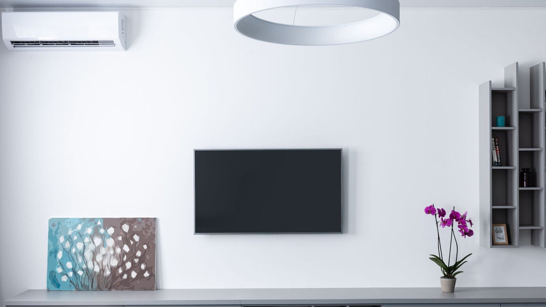 Best DIY mini split 2026: white ductless wall-mounted mini split in a modern living room, comparing MRCOOL 4th Gen, Pioneer and Zone Air