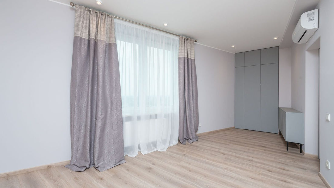Wall-mounted ductless unit in a modern empty room, showing air handler vs furnace cooling option