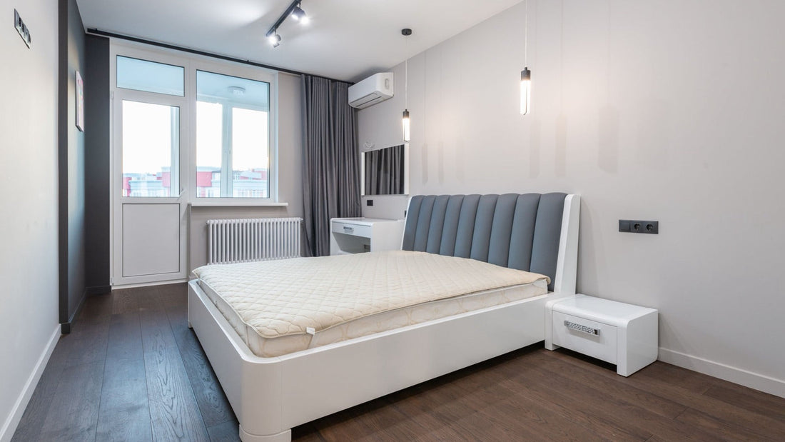 Pre-charged quick connect mini split brands - white ductless wall-mounted mini split air handler above a bed in a modern bedroom
